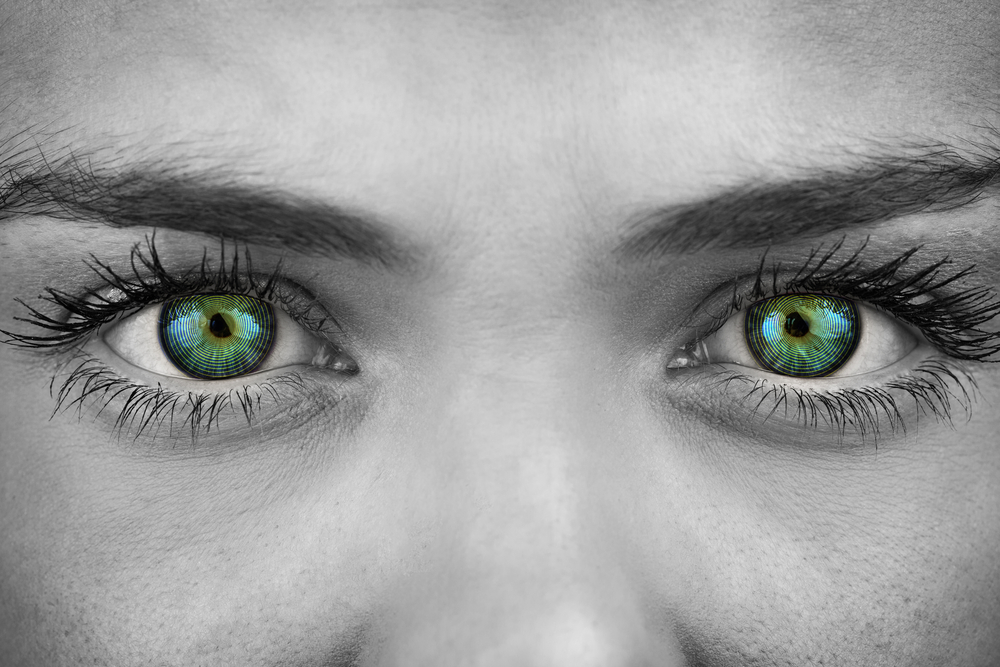 BW photo of woman with colorized green eyes