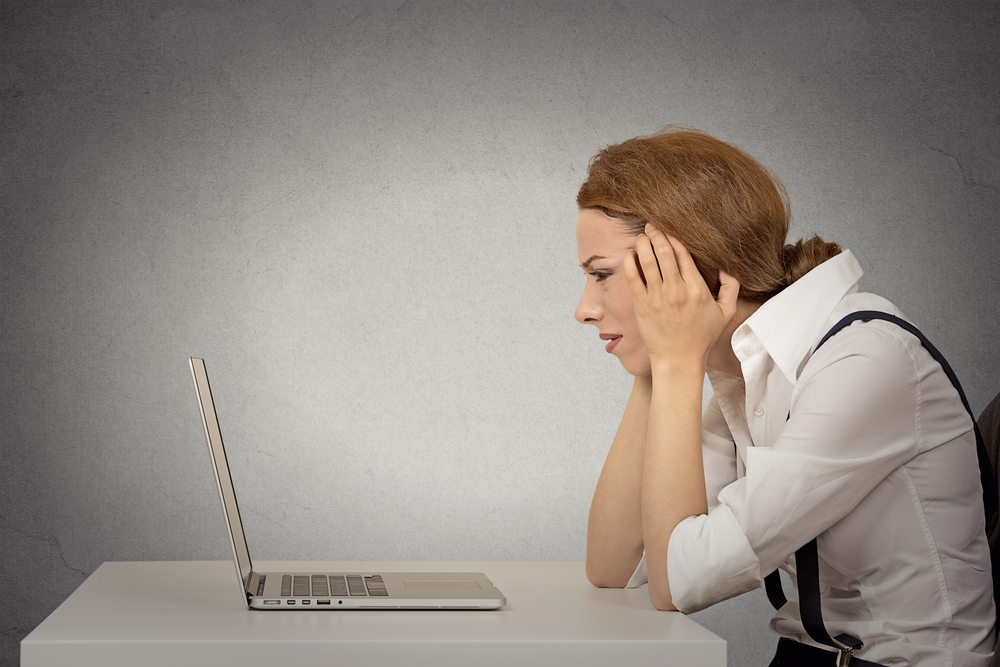 Frustrated Woman Looking At Computer