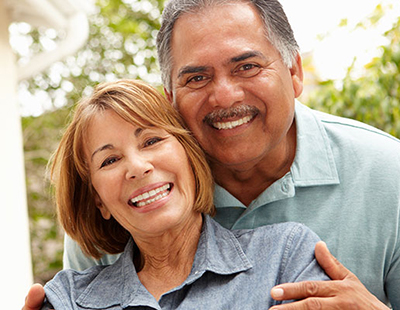 Older couple smiling after visiting the ophthalmologists at Berg Feinfield