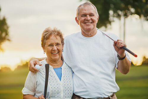 Older Couple Golfing