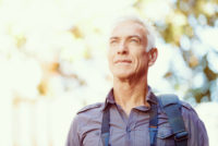 Mature photographer outdoors