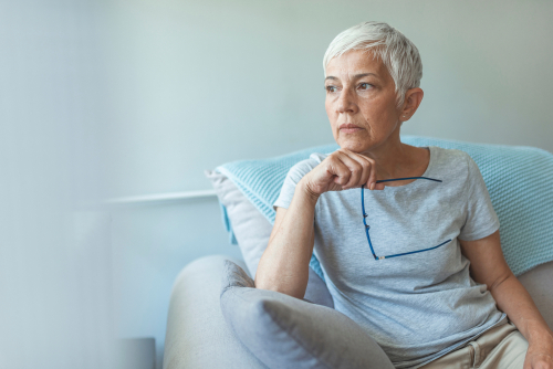 Older woman with eyeglasses considering Cataract Surgery