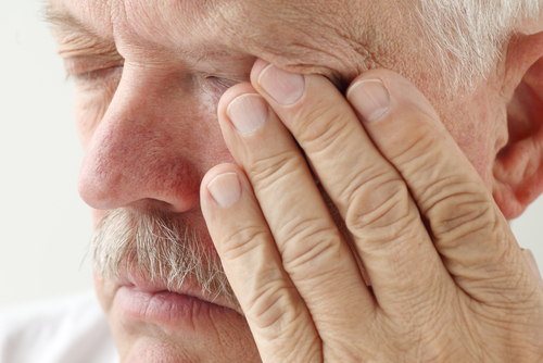 Older man suffering from dry eyes