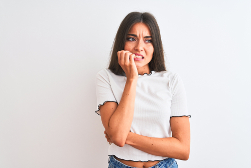 Young woman nervous to talk with her Eye Doctor