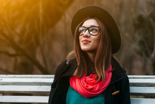 Stylish Young Woman Wearing Glasses and Considering LASIK Eye Surgery