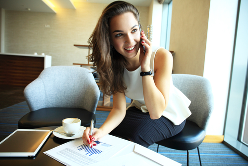 Excited Young Woman Talking on Phone