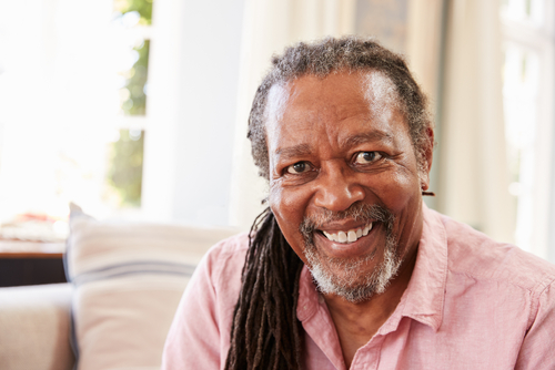 Older man with cataracts smiling