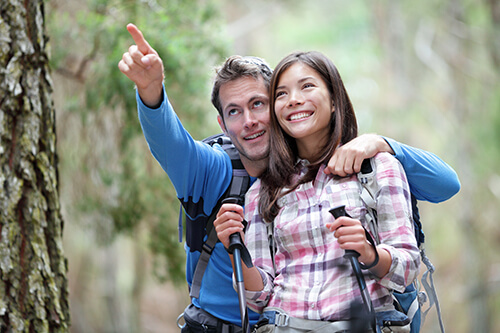 Young couple without glasses hiking